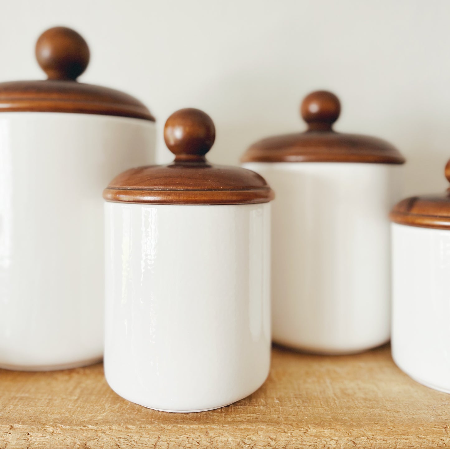 Set of Four Vintage Wooden Lidded Canisters