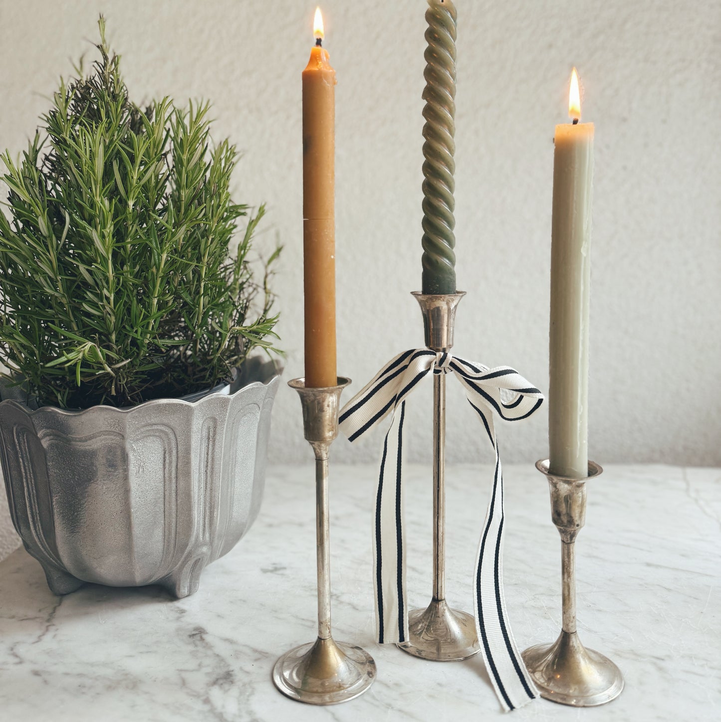 A Trio of Skinny Silver Candleholders